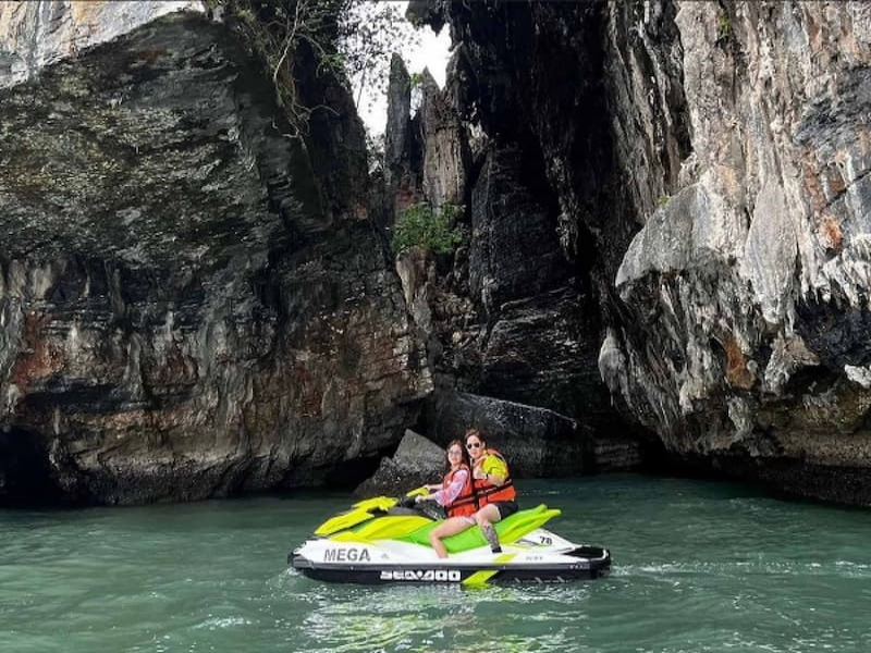 Couple posing for photo on jetski at Langkawi jetski tour by Mega Water Sports